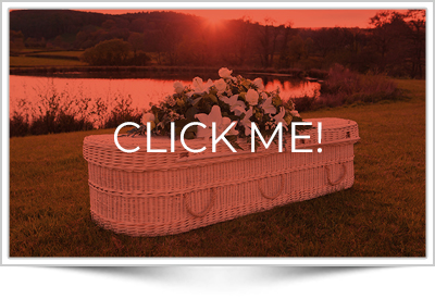 white woven funeral casket with sunset